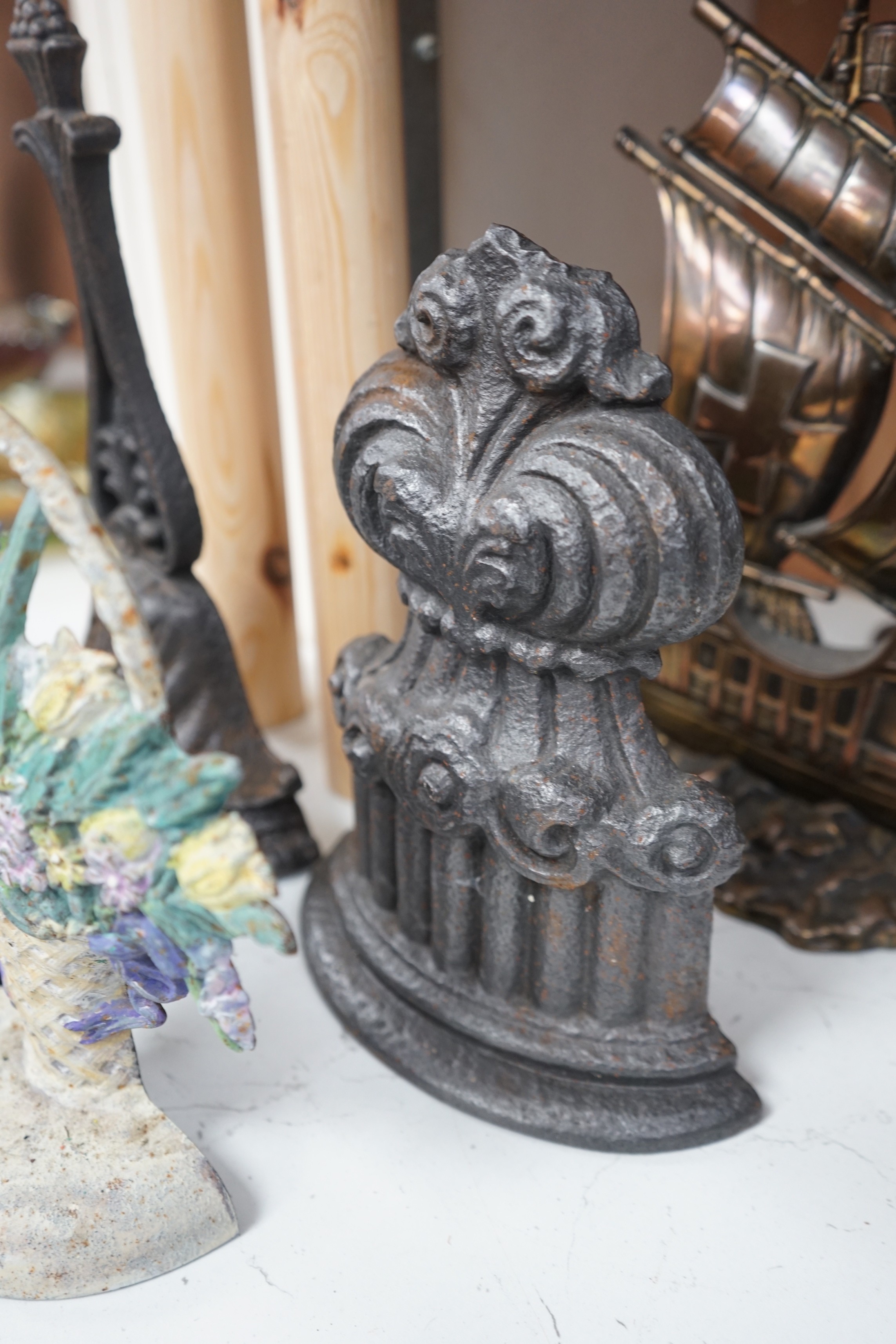 Seven assorted cast iron doorstops, tallest 38cms high